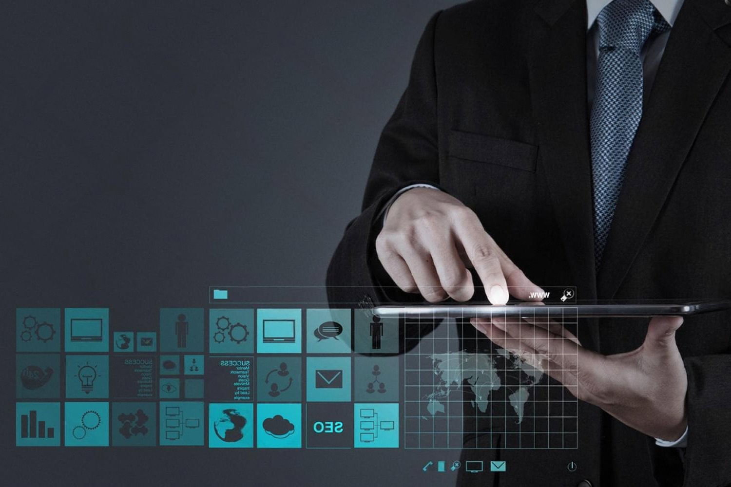 Person selecting website icons on a tablet, illustrating domain extension choices for UAE businesses